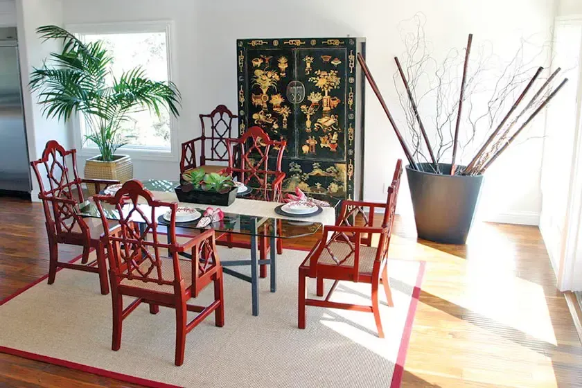 Dining nook with red chairs and morning light